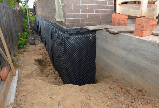 Happy homeowners after waterproofing job in Pavilion